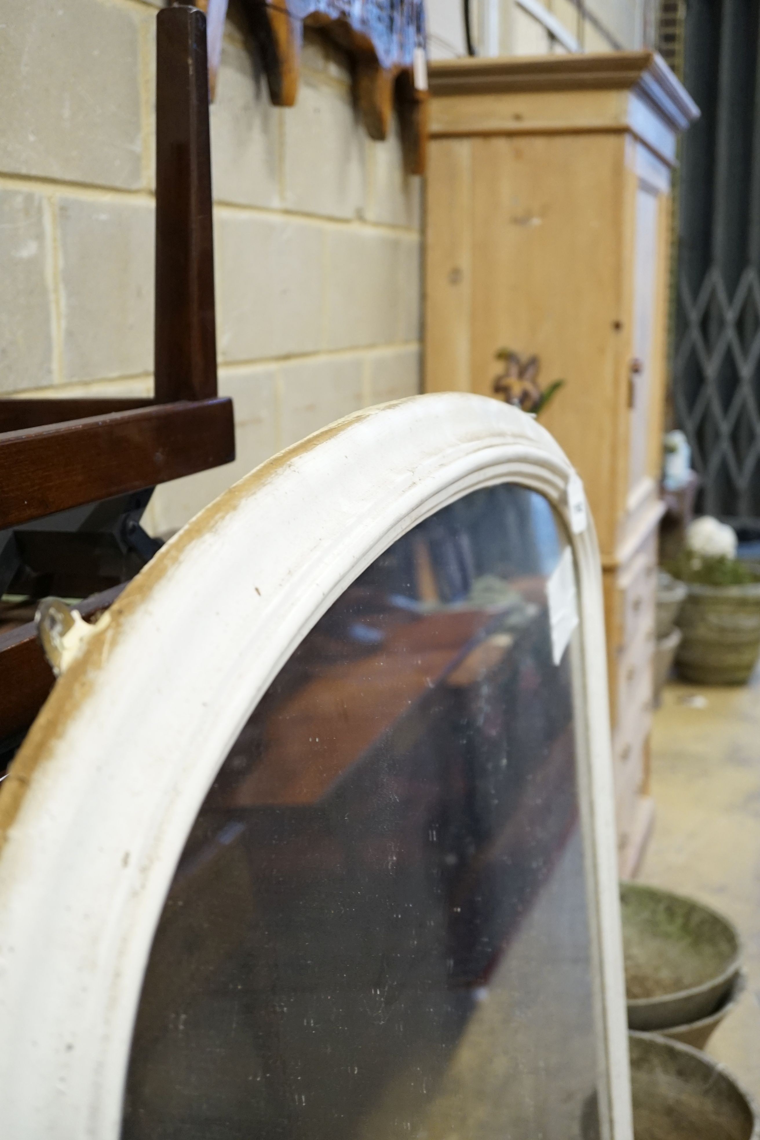 A late Victorian later white painted arched overmantel mirror, width 118cm, height 140cm